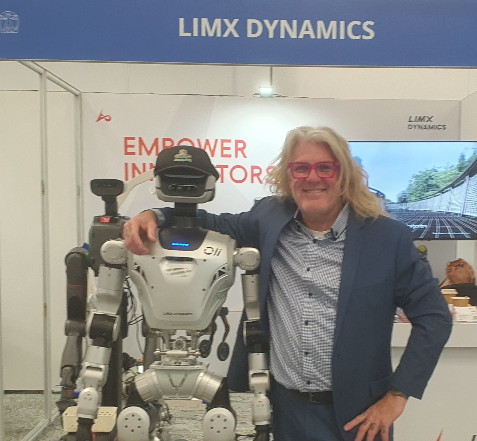 Close-up of LimX Oli on the RSS 2026 show floor with Cave from AussyBot